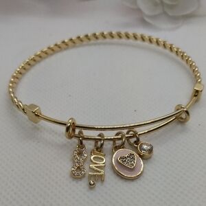 Love 14k flash gold plated,adjustable bracelet with charms. Nwot
